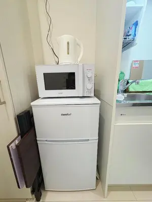 a microwave sitting on top of a refrigerator at SkyTree View Hikifune Home 1F-105 2min walk to station in Tokyo