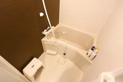 a white bathroom with a toilet and a sink at 5 Min to Ikebukuro by Tobu Tojo Line I Oyama Private Suites in Tokyo