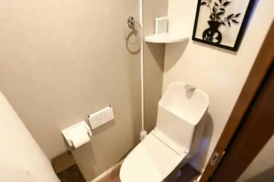 a small bathroom with a white toilet in a room at 5 Min to Ikebukuro by Tobu Tojo Line I Oyama Private Suites in Tokyo