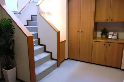 a staircase in a house with a stair case at Shibuya Goten in Tokyo