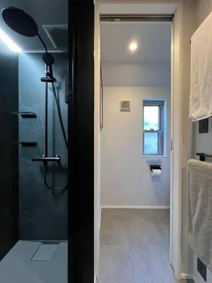 a bathroom with a shower with a glass door at Koenji Designer House, 3 bedrooms,100m2, 5min to Shinjuku in Tokyo