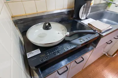 a frying pan sitting on top of a stove in a kitchen at Setagaya Quiet Residential Apartment201 in Tokyo