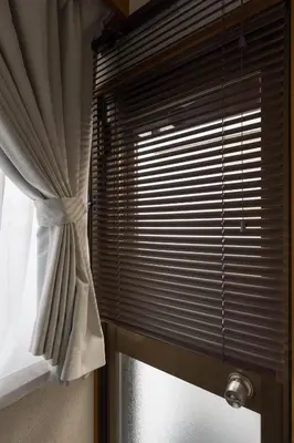 a window with a white curtain and a windowperature at Setagaya Quiet Residential Apartment201 in Tokyo