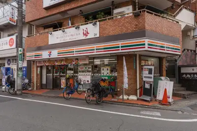 a store with bikes parked outside of it on the street at Setagaya Quiet Residential Apartment201 in Tokyo