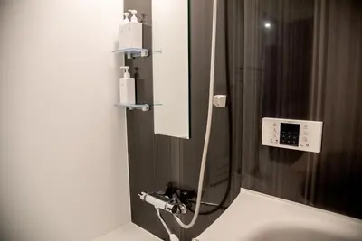 a bathroom with a sink and a mirror at iruka hotel 15 minutes to Shinjuku and Shibuya in Tokyo