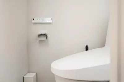 a bathroom with a white toilet and a sink at Diamond Residences in Tokyo