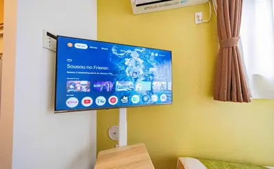 a flat screen tv hanging on a wall at 30 min to Ueno, Asakusa, Skytree, Akihabara, Ginza in Tokyo