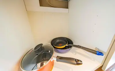 a kitchen counter with a strainer and a pot at 30 min to Ueno, Asakusa, Skytree, Akihabara, Ginza in Tokyo