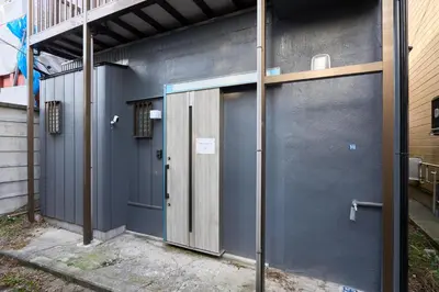 a pair of doors on the side of a building at YAHIRO Base, 6m walk Yahiro Sta 94m2 2LDK Villa,3 Baths in Tokyo