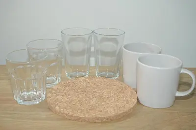 a group of glasses and a coaster on a table at INA HOUSE Koiwa 102 in Tokyo
