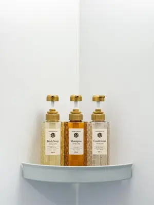 four bottles of essential oils on a shelf at \u685c\u82b1\u4e0a\u6c34 in Tokyo