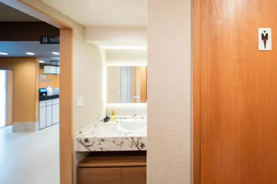 a bathroom with a sink and a mirror at MARUMI HOTEL Asakusa\u6d45\u8349 in Tokyo