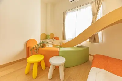 a room with a bed and a couch and two stool at KOKORO INN TOKYO 5-minute walk to Senso-ji Temple Four-story private house with two bathrooms luxury stay in Tokyo