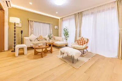 a living room with a couch and a table at KOKORO INN TOKYO 5-minute walk to Senso-ji Temple Four-story private house with two bathrooms luxury stay in Tokyo