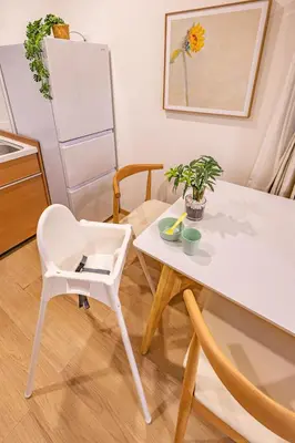 a kitchen with a white table and a white chair at KOKORO INN TOKYO 5-minute walk to Senso-ji Temple Four-story private house with two bathrooms luxury stay in Tokyo