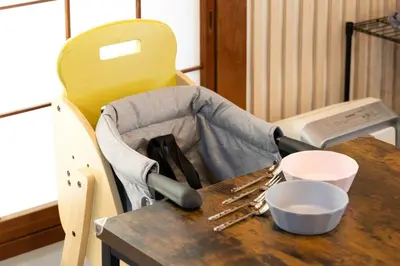 a table with a chair with utensils on it at Soresta INN \u7be0\u5d0e in Tokyo
