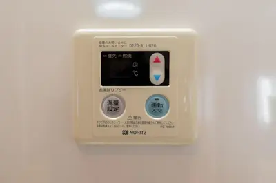 an air monitor is attached to a white wall at SYLA HOTEL Akasaka in Tokyo