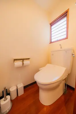 a bathroom with a white toilet and a window at SYLA HOTEL Akasaka in Tokyo