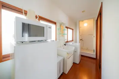 a bathroom with a sink and a tv on top at SYLA HOTEL Akasaka in Tokyo