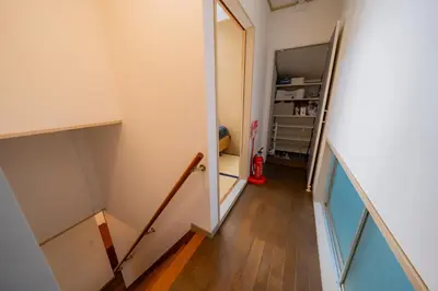a hallway with a stairway leading to a room at SYLA HOTEL Akasaka in Tokyo
