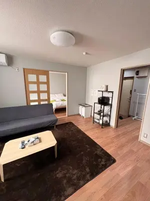a living room with a couch and a coffee table at \u30a2\u30e0\u30db\u30fc\u30e0 in Tokyo