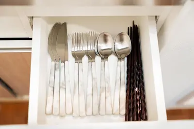 a group of silver utensils in a drawer at Promotion Asakusa , 1 room, 8 mins to ST Max 2P \u8d85\u9ad8\u6027\u4ef7\u6bd4 \u6d45\u8349\u5168\u65b0\u88c5\u4fee \u8f66\u7ad98\u5206\u949f \u6700\u59272\u4eba in Tokyo