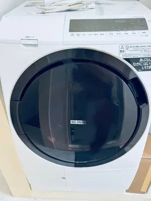 a white washing machine with its door open at Kitashinjuku 2DK-2F-B in Tokyo