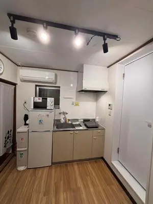 a small kitchen with a sink and a refrigerator at KENKOU Room -\u5065\u5eb7\u30eb\u30fc\u30e0 \u6771\u4eac\u83ca\u5ddd- in Tokyo
