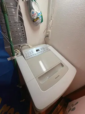 a white toilet in a corner of a room at KENKOU Room -\u5065\u5eb7\u30eb\u30fc\u30e0 \u6771\u4eac\u83ca\u5ddd- in Tokyo