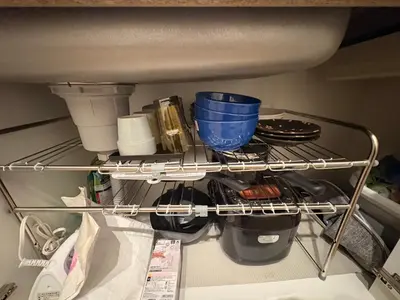 a shelf in a refrigerator filled with food and utensils at KENKOU Room -\u5065\u5eb7\u30eb\u30fc\u30e0 \u6771\u4eac\u83ca\u5ddd- in Tokyo