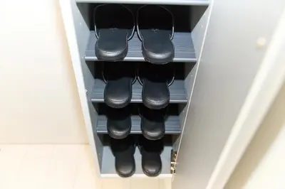 a drawer with a bunch of pairs of shoes at Greenhills Shirokane in Tokyo