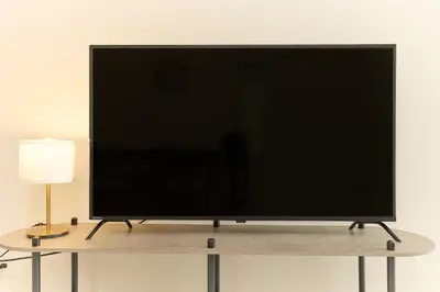 a large flat screen tv sitting on top of a table at Greenhills Shirokane in Tokyo