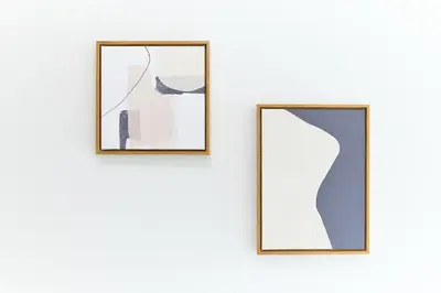 two framed mirrors hanging on a white wall at Greenhills Shirokane in Tokyo