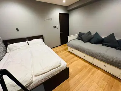 a bedroom with a bed in a room at Vacances Skytree Plaza in Tokyo
