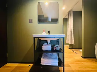 a bathroom with a sink and a mirror at Vacances Skytree Plaza in Tokyo
