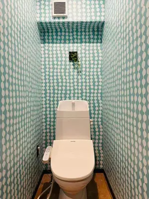 a bathroom with a toilet in a blue and white wall at Vacances Skytree Plaza in Tokyo