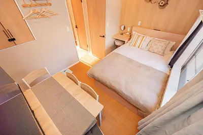 a small room with a bed and a table at Asakusa Miyabi Inn 2F in Tokyo