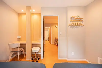 a room with a desk and a table with a chair at Asakusa Miyabi Inn 1F in Tokyo
