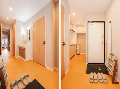 a living room with a door and a hallway with shoes on the floor at Asakusa Miyabi Inn 1F in Tokyo