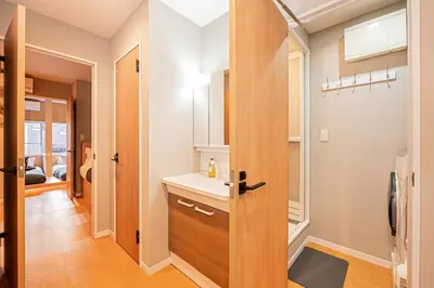 a bathroom with a sink and a mirror at Asakusa Miyabi Inn 1F in Tokyo