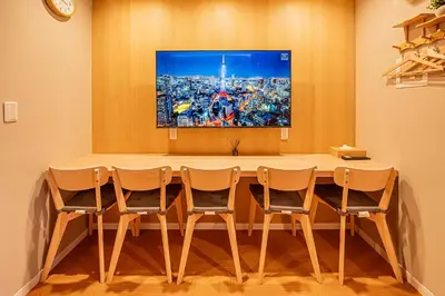 a conference room with a table and four chairs at Asakusa Miyabi Inn 1F in Tokyo