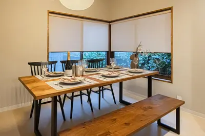 a dining room with a wooden table and chairs at HAN'S EBISU Hanare - Shibuya - Entire Renovated House in Tokyo