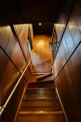 a staircase in a building with wooden walls at HAN'S EBISU Hanare - Shibuya - Entire Renovated House in Tokyo