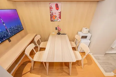 a dining room with a wooden table and chairs at Komorebi Asakusa 202 Cozy 6P Stay The 77 House Tokyo in Tokyo