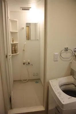 a bathroom with a shower and a toilet at Jasnine House in Tokyo