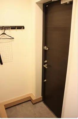 a black door in a room with at Jasnine House in Tokyo