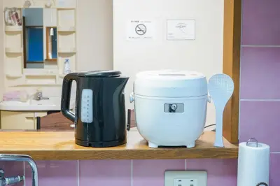a coffee maker sitting on a counter in a kitchen at Asakusa Hub Stay in Tokyo
