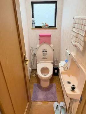 a small bathroom with a toilet and a sink at Hotel Hanamichi in Tokyo