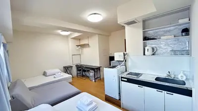 a small kitchen with a sink and a refrigerator at Skytree\u8eca\u7ad9\u5f92\u6b655\u5206 \u9802\u6a13\u6674\u7a7a\u5854\u6771\u4eac\u591c\u666f \u6a5f\u5834\u76f4\u9054\u514d\u63db\u8eca \u5eda\u623f \u6d17\u8863\u6a5f \u6709\u96fb\u68af ABCDD in Tokyo