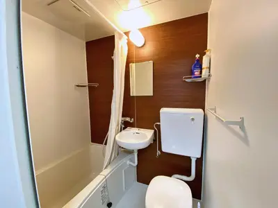 a small bathroom with a sink and a toilet at Tokyo\u591c\u666f 8\u5957\u885b\u6d74 8\u9593\u5957\u623f Skytree\u5730\u9435\u5f92\u6b655\u5206 \u6a5f\u5834\u76f4\u9054 \u6d17\u8863\u6a5f \u96fb\u68af 2\u5c64 in Tokyo